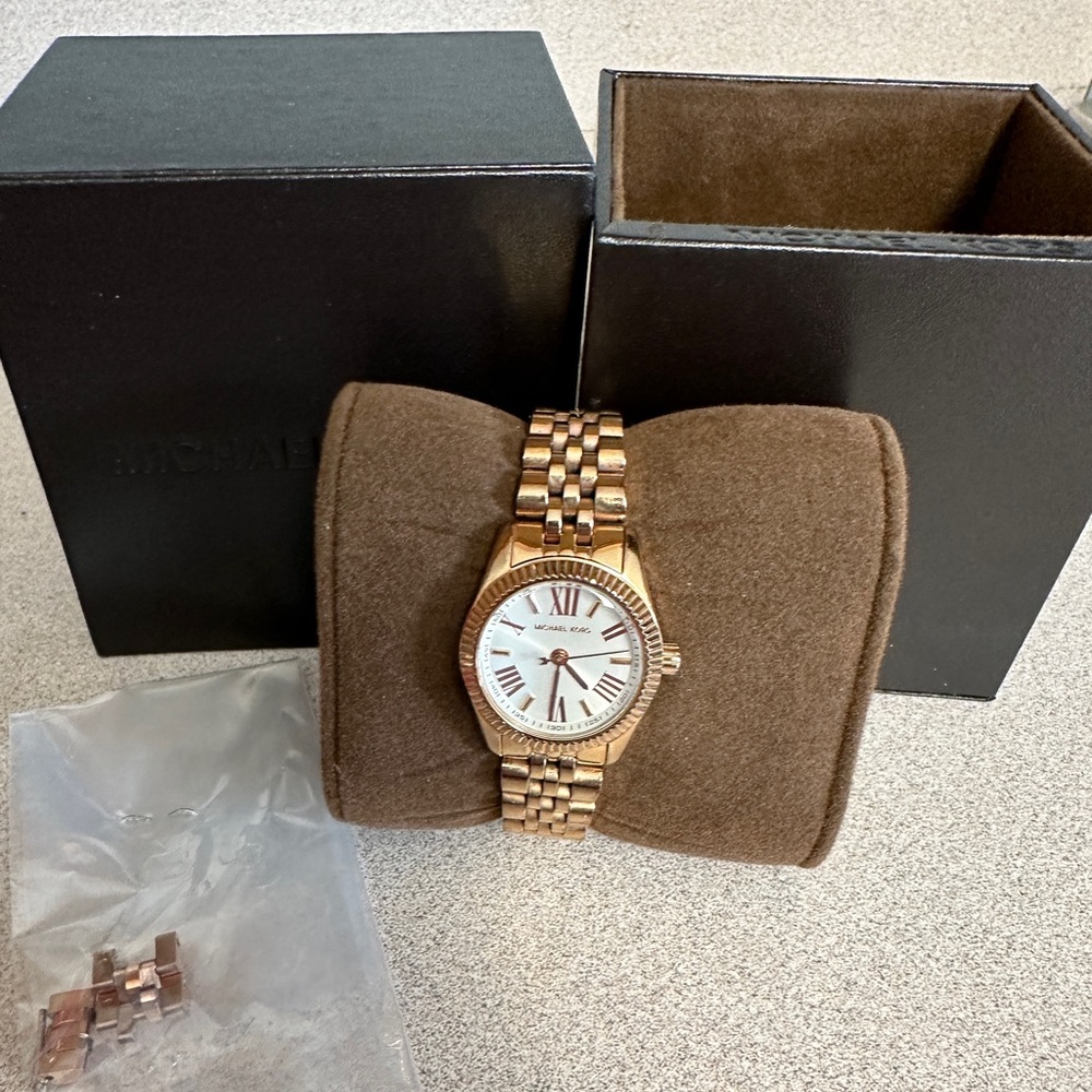 Ladies Rose Gold Michael Kors watch. Brand new battery with extra links.